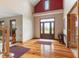 Inviting entryway with hardwood floors, a beautiful front door, and staircase access at 7357 Windridge Way, Brownsburg, IN 46112