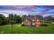 Beautiful brick home with a well-manicured lawn and professional landscaping at 7357 Windridge Way, Brownsburg, IN 46112
