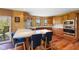 Kitchen with wooden cabinets, a white countertop, and a central island seating area at 7357 Windridge Way, Brownsburg, IN 46112
