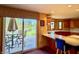 Kitchen featuring stainless appliances, bar seating and direct access to deck area at 7357 Windridge Way, Brownsburg, IN 46112