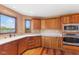 Kitchen boasting custom cabinets, stainless steel appliances, and elegant countertops at 7357 Windridge Way, Brownsburg, IN 46112