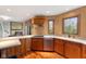 Well-equipped kitchen with custom cabinets, modern appliances, and an expansive view at 7357 Windridge Way, Brownsburg, IN 46112