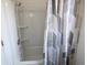 Well-maintained bathroom featuring a tub and shower combination with a modern shower curtain at 7438 Melanie Ln # 13, Indianapolis, IN 46217