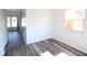 A naturally lit room featuring wood-style flooring and a window for a welcoming atmosphere at 7438 Melanie Ln # 13, Indianapolis, IN 46217