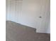 Bright bedroom with plush carpeting, closet with bifold doors, and a private ensuite at 7438 Melanie Ln # 13, Indianapolis, IN 46217