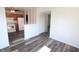 Bright living room with sleek wood flooring and an open layout, connecting seamlessly to the kitchen at 7438 Melanie Ln # 13, Indianapolis, IN 46217