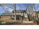 Expansive backyard featuring a wooden deck and a concrete patio area at 7474 Oakland Hills Dr, Indianapolis, IN 46236