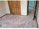 Bedroom featuring carpet, a closet and neutral decor at 7474 Oakland Hills Dr, Indianapolis, IN 46236