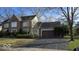 Attractive two-story brick home with a paved driveway and established landscaping at 7474 Oakland Hills Dr, Indianapolis, IN 46236