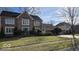 Inviting two-story brick home featuring a lush green lawn and attractive curb appeal at 7474 Oakland Hills Dr, Indianapolis, IN 46236