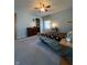 Bedroom with blue walls, carpet and traditional furnishings at 7632 S Sherman Dr, Indianapolis, IN 46237