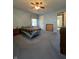 Bedroom with blue walls, carpet, window and ceiling fan at 7632 S Sherman Dr, Indianapolis, IN 46237