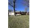 Charming single-story brick home with a two-car garage, covered porch, and well-maintained lawn at 7632 S Sherman Dr, Indianapolis, IN 46237
