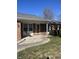 Close-up of a cozy front porch with a swing, complemented by a charming brick facade at 7632 S Sherman Dr, Indianapolis, IN 46237