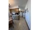 Eat-in kitchen with wood cabinets, tile floor and white appliances at 7632 S Sherman Dr, Indianapolis, IN 46237