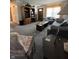 Spacious living room with carpet, sofa and large bookshelf at 7632 S Sherman Dr, Indianapolis, IN 46237