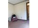Room with neutral walls, carpeted floor, and view into adjacent bathroom at 7632 S Sherman Dr, Indianapolis, IN 46237