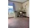 Room with window providing natural light, neutral walls, and carpeted flooring at 7632 S Sherman Dr, Indianapolis, IN 46237