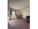 Room with window providing natural light, neutral walls, and carpeted flooring at 7632 S Sherman Dr, Indianapolis, IN 46237