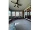 Bright sunroom with neutral decor, including multiple windows and comfortable seating arrangements at 7632 S Sherman Dr, Indianapolis, IN 46237