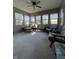 Bright and sunny sunroom featuring ample windows and cozy seating, perfect for relaxation at 7632 S Sherman Dr, Indianapolis, IN 46237