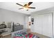 Neutral themed bedroom featuring carpet floors, a ceiling fan and double door closet at 7710 Eagle Crescent Dr, Zionsville, IN 46077