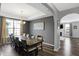 Elegant dining room boasts a tray ceiling, hardwood floors, lots of natural light, and an entrance to the living room at 7710 Eagle Crescent Dr, Zionsville, IN 46077