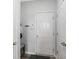 Neat entryway featuring a white door, gray walls, and a small bench with storage beneath at 7710 Eagle Crescent Dr, Zionsville, IN 46077