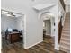 Inviting foyer boasts hardwood floors, arched doorways, and access to an office, dining room, and stairway to the second floor at 7710 Eagle Crescent Dr, Zionsville, IN 46077