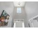 Spacious foyer with high ceilings, a large window, and a clear view of the home's entryway at 7710 Eagle Crescent Dr, Zionsville, IN 46077