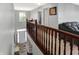 Spacious foyer overlooking the front door, with hardwood railing and ample natural light enhancing the welcoming feel at 7710 Eagle Crescent Dr, Zionsville, IN 46077