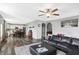 Open concept living room features hardwood floors, lots of natural light, and access to the dining room and kitchen at 7710 Eagle Crescent Dr, Zionsville, IN 46077
