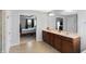 Well lit bathroom featuring double sink vanity and an open view to the main bedroom at 7710 Eagle Crescent Dr, Zionsville, IN 46077