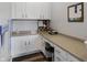 Bright office space with white cabinets, a long countertop, and natural light, creating a functional workspace at 7710 Eagle Crescent Dr, Zionsville, IN 46077