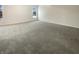 Spacious bedroom features neutral carpet, bright windows, and ample natural light at 825 Treyburn Green Dr, Indianapolis, IN 46239
