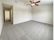Neutral bedroom featuring modern ceiling fan, neutral carpet, and an open doorway at 825 Treyburn Green Dr, Indianapolis, IN 46239