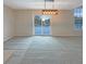 Well-lit dining area with a modern light fixture and a view to the backyard at 825 Treyburn Green Dr, Indianapolis, IN 46239