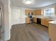 Modern kitchen features stainless steel appliances, ample cabinet space, and durable flooring at 825 Treyburn Green Dr, Indianapolis, IN 46239