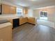 Efficient kitchen with light wood cabinets and an open view to the dining area at 825 Treyburn Green Dr, Indianapolis, IN 46239