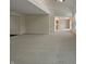 Open-concept living room with high ceilings and neutral carpet throughout at 825 Treyburn Green Dr, Indianapolis, IN 46239