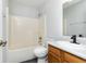 Clean bathroom featuring a shower-tub combo, toilet, and vanity at 8417 Southern Springs Way, Indianapolis, IN 46237