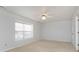 Neutral bedroom with carpeted floors, ceiling fan, and a bright window at 8417 Southern Springs Way, Indianapolis, IN 46237