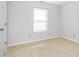 Neutral bedroom with carpeted floors and a bright window at 8417 Southern Springs Way, Indianapolis, IN 46237