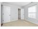 Bright bedroom with neutral carpet, closet and natural light from the window at 8417 Southern Springs Way, Indianapolis, IN 46237