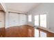 Bedroom features hardwood floors, large closets, and access to a private balcony at 8417 Southern Springs Way, Indianapolis, IN 46237