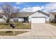 Charming single-story home with a well-maintained lawn and attached two-car garage at 8417 Southern Springs Way, Indianapolis, IN 46237