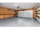 Spacious garage with ample storage racks and epoxy flooring at 8417 Southern Springs Way, Indianapolis, IN 46237