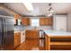 Bright kitchen with stainless steel appliances, wood cabinetry, and light countertops at 8417 Southern Springs Way, Indianapolis, IN 46237