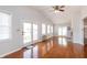 Bright living room with vaulted ceilings, hardwood floors, and a walk-out patio at 8417 Southern Springs Way, Indianapolis, IN 46237