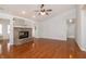 Large living room with vaulted ceiling, fireplace, laminate flooring, and neutral color scheme at 8417 Southern Springs Way, Indianapolis, IN 46237